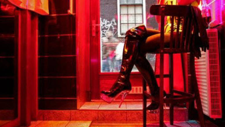 Amsterdam's red light district without a condom? 'Not for a million!'