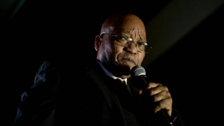 Zuma on the brink as S.Africa police target his allies