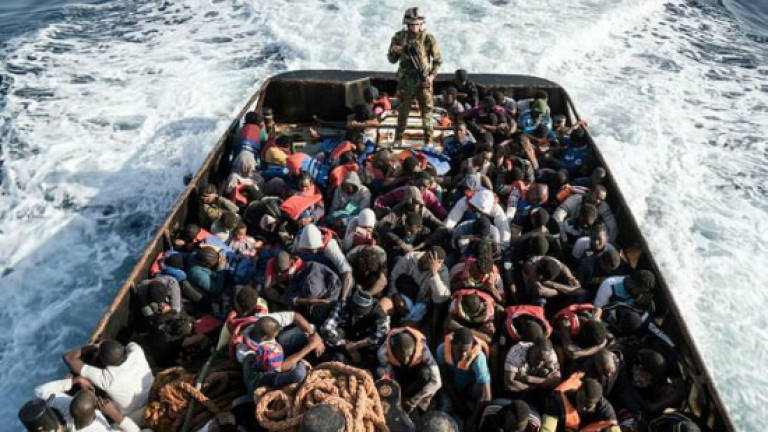 France to conduct asylum seeker checks in Libya: Macron