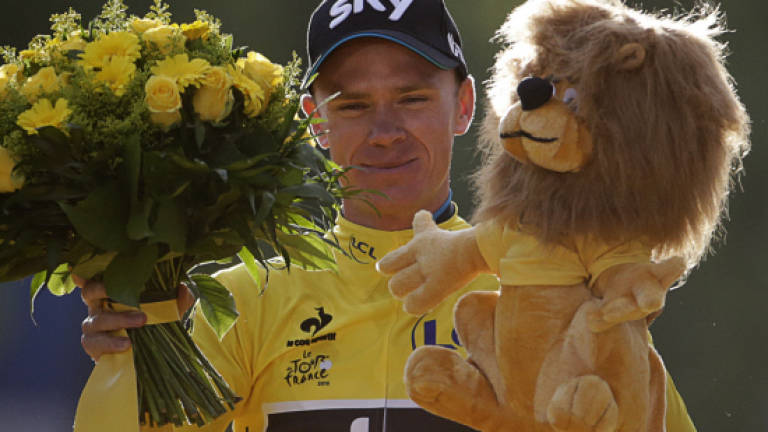 Froome defies abuse to win second Tour de France