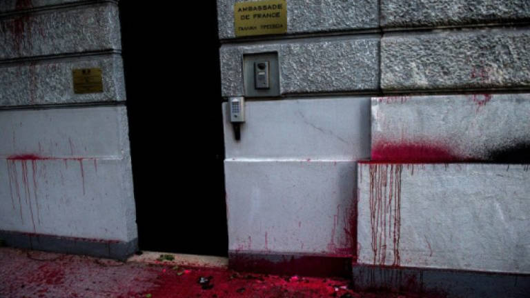 Greek anarchists throw paint at French consulate