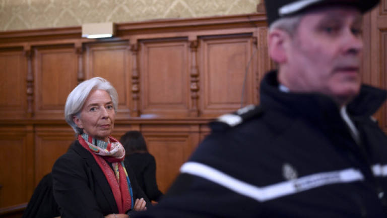 IMF's Lagarde down, not out, despite conviction