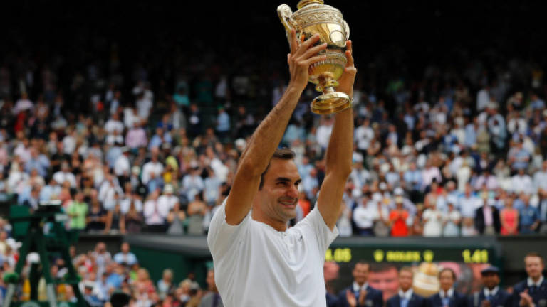 Federer vows to defend Wimbledon title in 2018