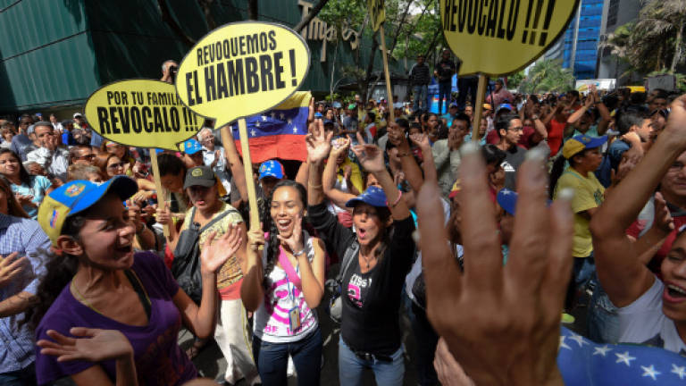 Opposition demos draw scant crowds in tense Venezuela