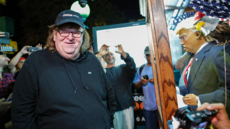 In 'Trumpland' Michael Moore seeks to rally Clinton support
