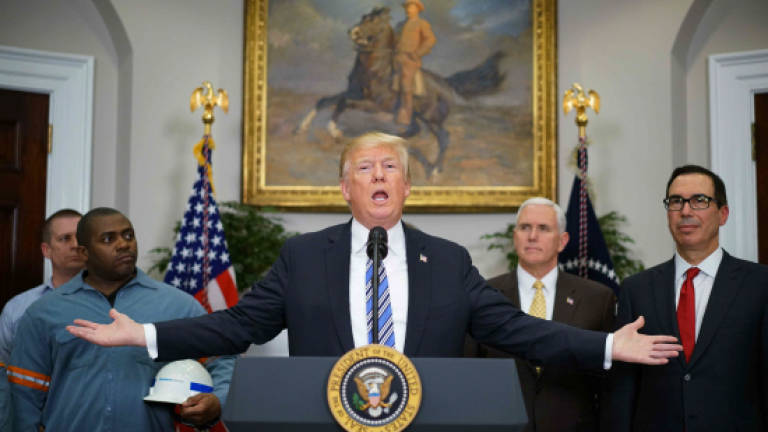 Trump rolls out sweeping tariffs, defying trade war warnings