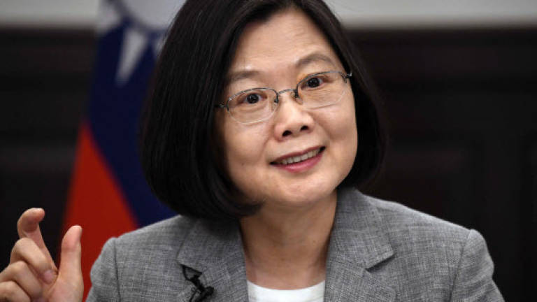 Taiwan's Tsai urges world to stand up to China