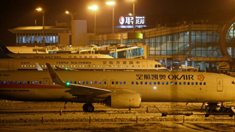 All night flights relieve thousands stranded on S. Korea island