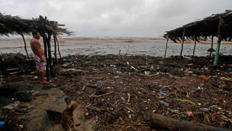 Tropical storm kills 20 in C. America, heads for US