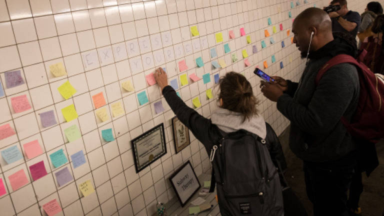New Yorkers vent Trump anger on subway Post-it notes