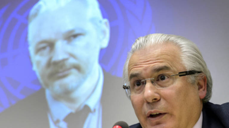 Assange demands rape case files before Sweden questions him