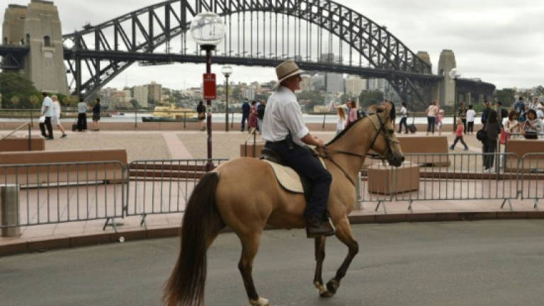 Aussie cowboys join Sydney rally against coal and gas mining