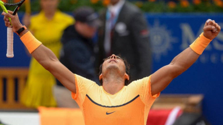 Nerveless Nadal makes Barcelona semis
