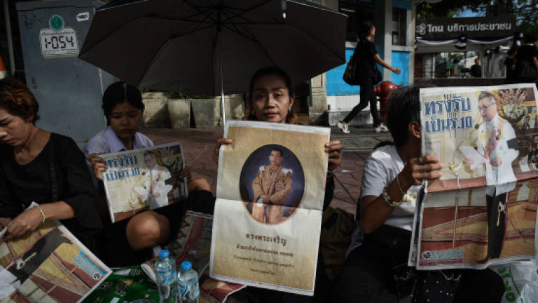 Thai dissident arrested for sharing new king article on Facebook
