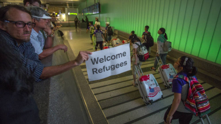 US six-country travel ban takes effect with few exceptions for relatives