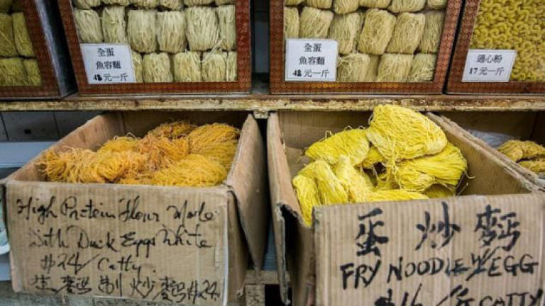 Street joints and empires in noodle-crazed Hong Kong