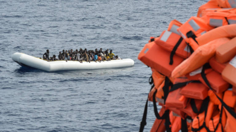Rescuers find 4 bodies, empty dinghy off Libya