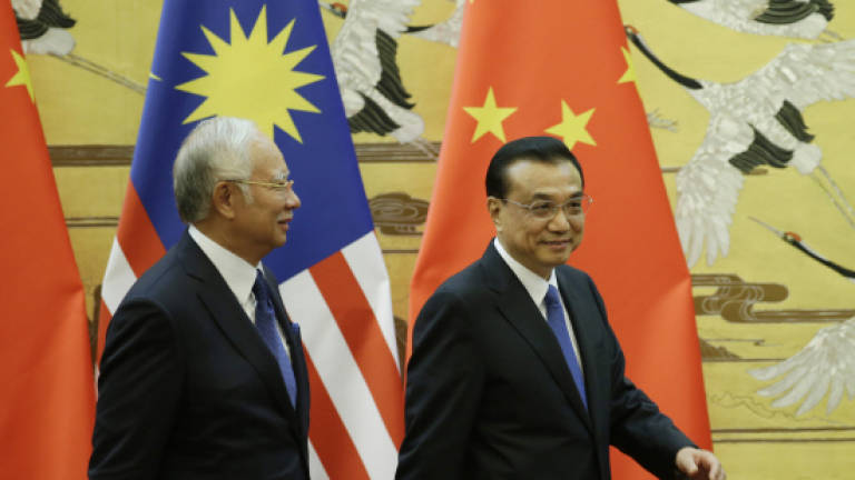 Malaysia and China sign 14 MoUs