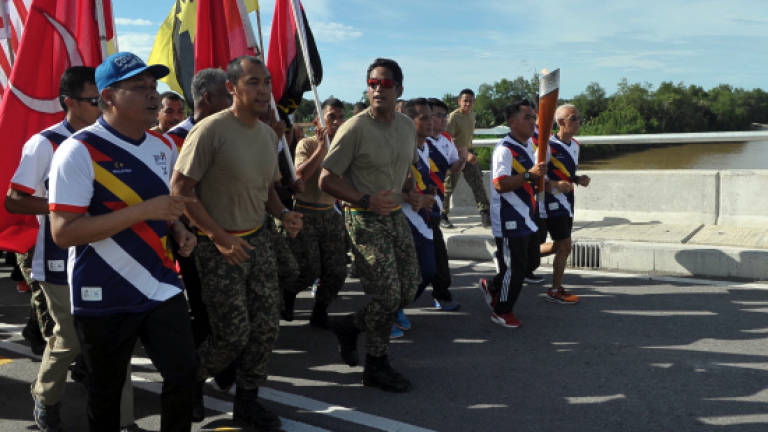 SEA games torch run crosses Batang Sadong Bridge in Samarahan SEA games torch run crosses Batang Sadong Bridge in Samarahan