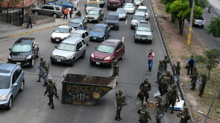 Army clears Honduras streets of protesters alleging poll fraud