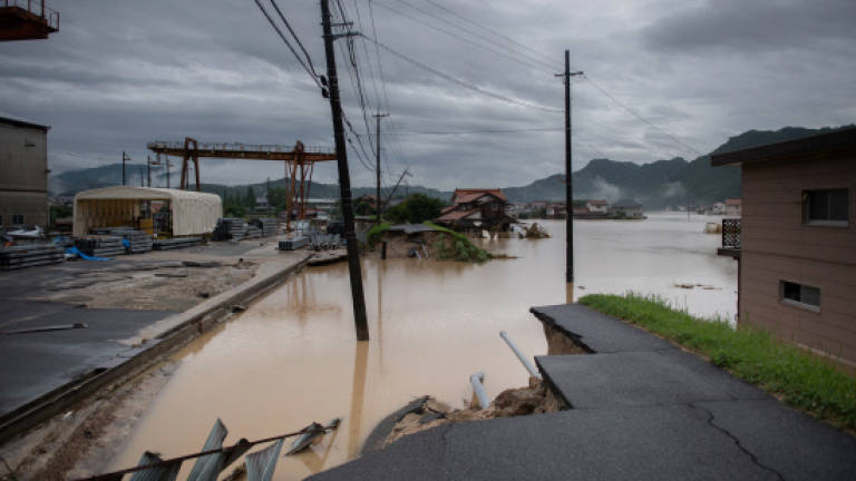 Japan PM cancels overseas trip as rain toll hits 100: Local media