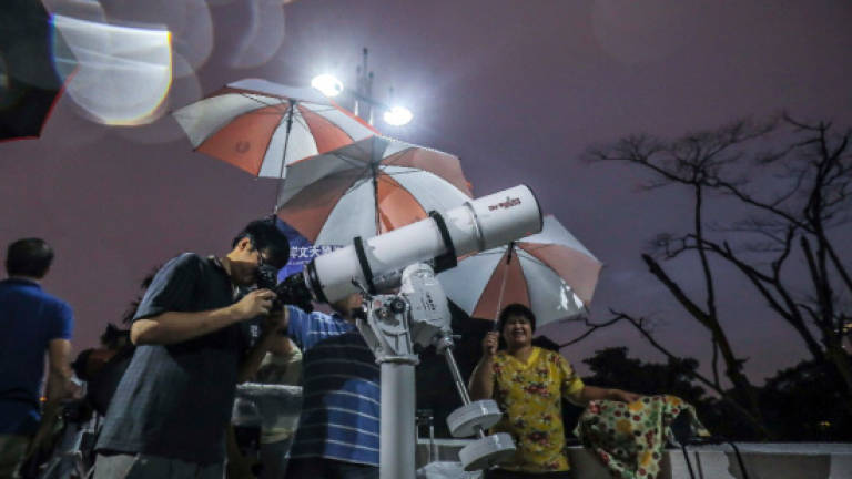 Rain and cloud hampered sky watchers to catch super blue blood moon