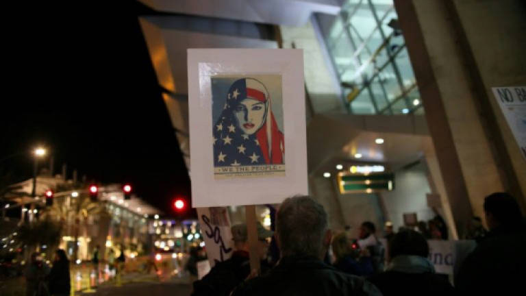 Revised Trump travel ban facing new court challenges