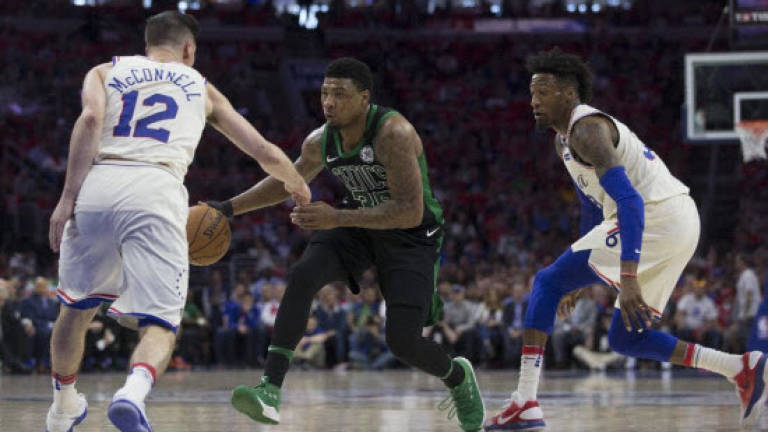 Saric, McConnell star as Sixers avoid Celtics sweep