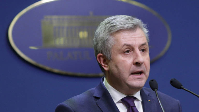 Romanian minister quits after mass protests