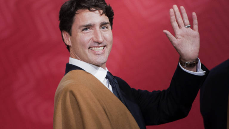 Canada's Trudeau welcomes all immigrants in sunny Twitter message
