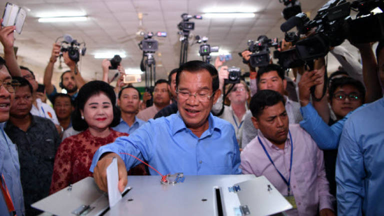 Cambodia ruling party claims 'huge victory' in vote decried as 'sham'