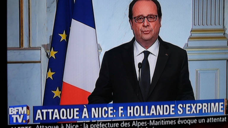 Sombre Hollande denounces third 'terrorist' act in 18 months