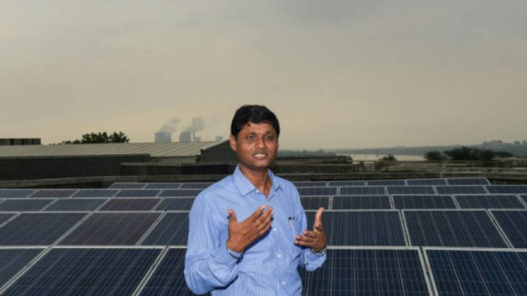 Air pollution throws shade on India's solar success (Updated)