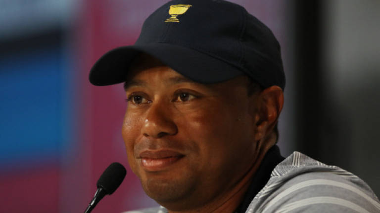 Woods relishes assistant's role as rehab grinds on
