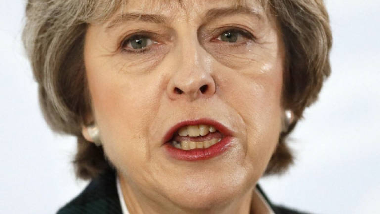 May puts Britain on course for 'hard' Brexit