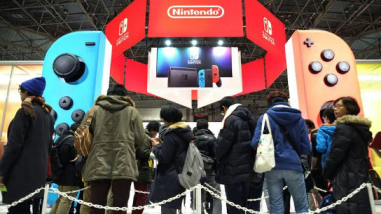 Nintendo ups profit forecast on strong Switch sales