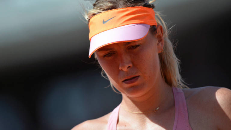 Sharapova withdraws from Stanford with left arm injury