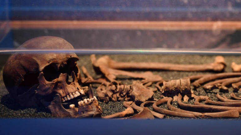 Skeletons of London's past exposed in rail line dig
