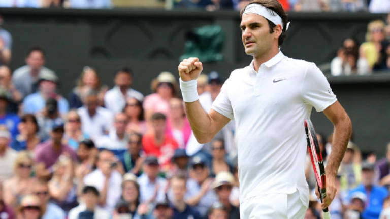 Federer sights new record and Wimbledon semi-finals