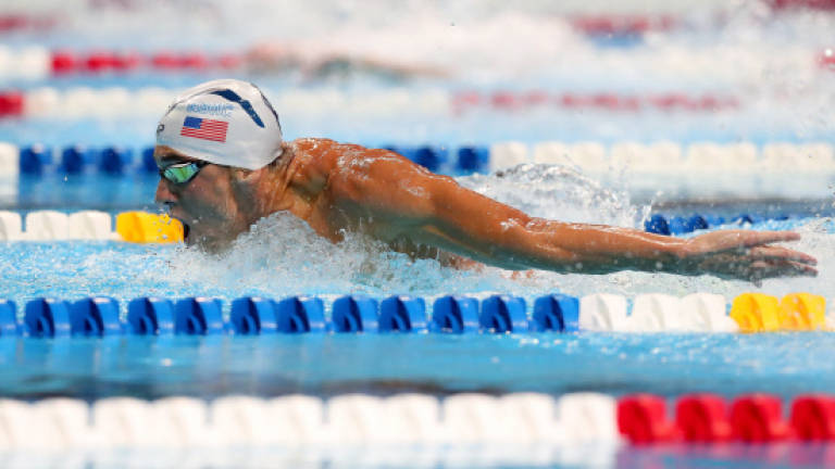Phelps flies into fifth Olympics, Franklin also Rio-bound