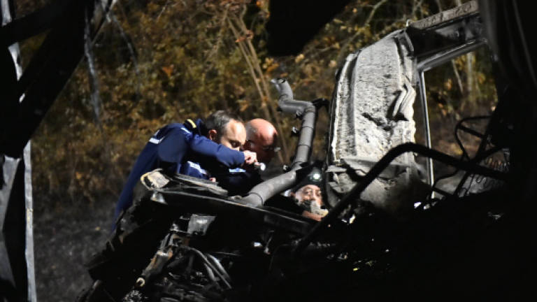 At least 43 dead in coach crash blaze