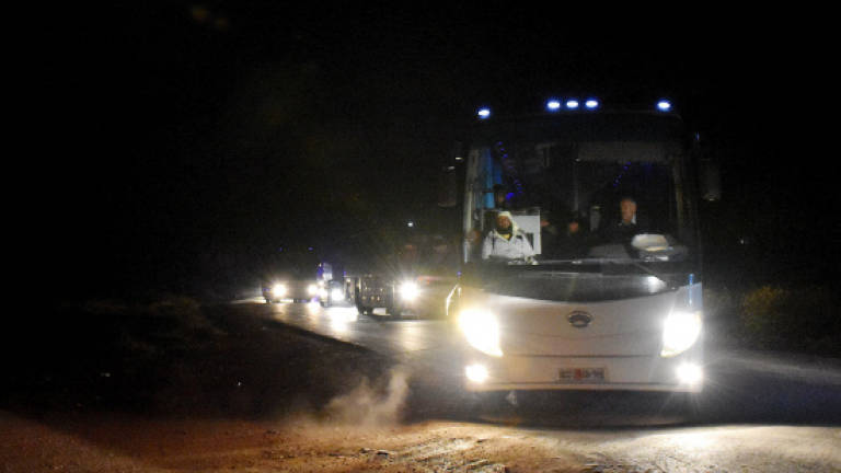 Buses evacuate hundreds from four besieged Syria towns
