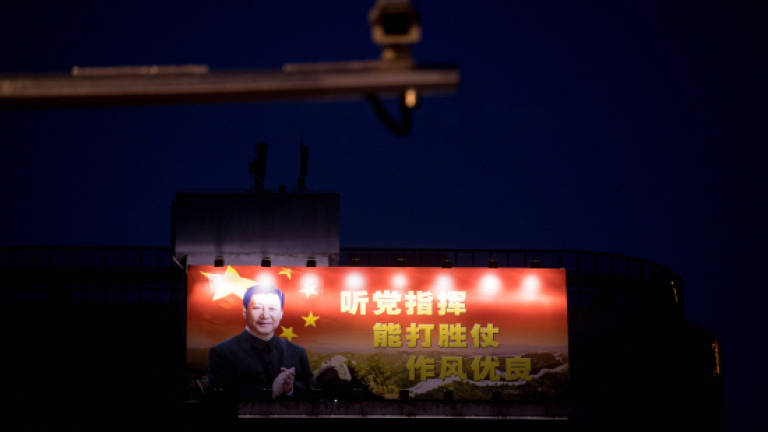 With little suspense, Xi to secure lifetime presidency