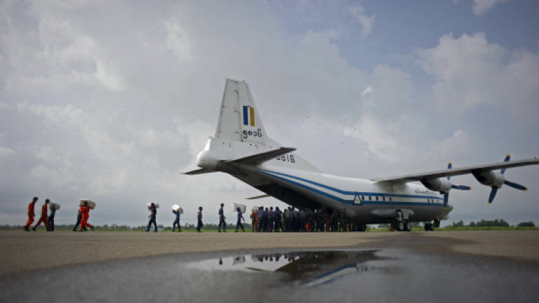 Fishing boat hooks tail of crashed Myanmar military plane