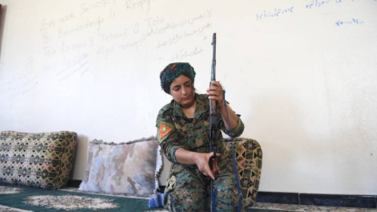 Sold by IS in Raqa, Yazidi female fighters back for revenge