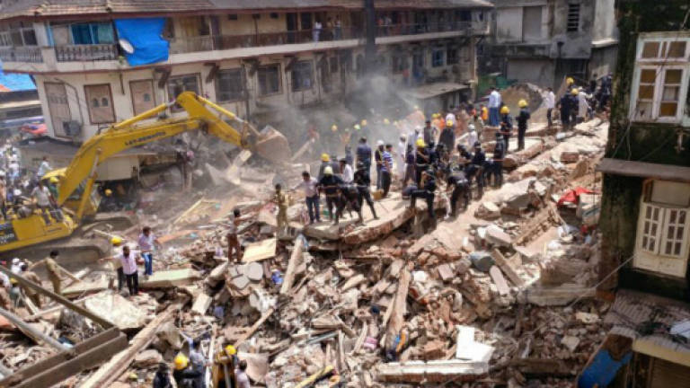 Seven dead, dozens feared trapped in Mumbai building collapse
