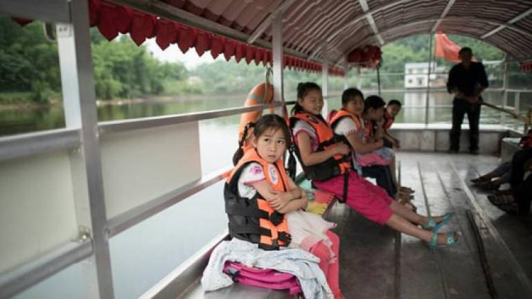 Backpacks, books and life jackets: Time for school in China