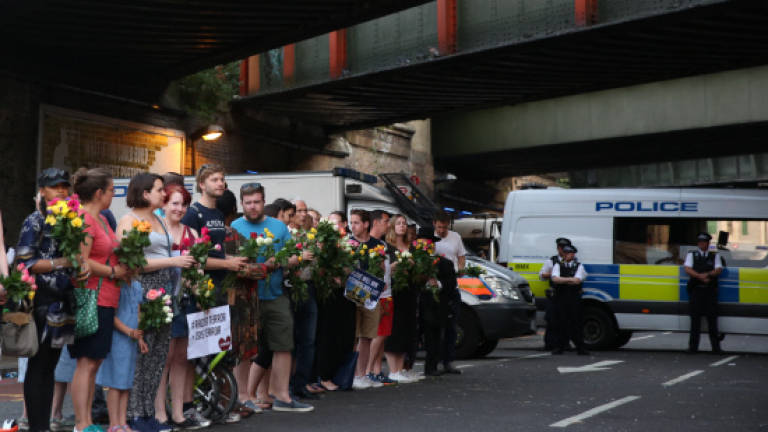 Londoners hold vigil for Muslim terror attack victims