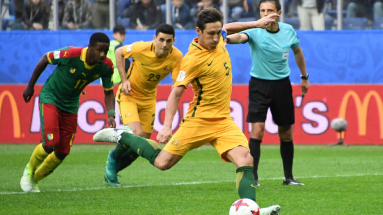 Milligan penalty rescues draw for Australia