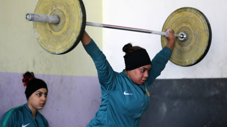 Iraq's girl weightlifters also boost family finances